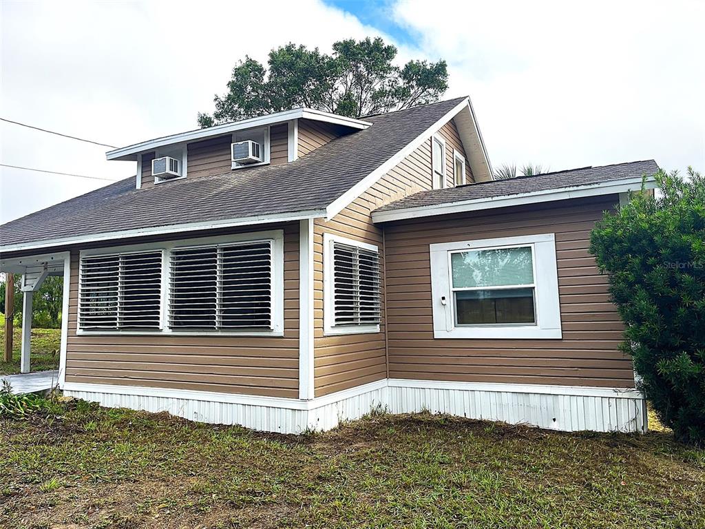 a front view of a house with garage