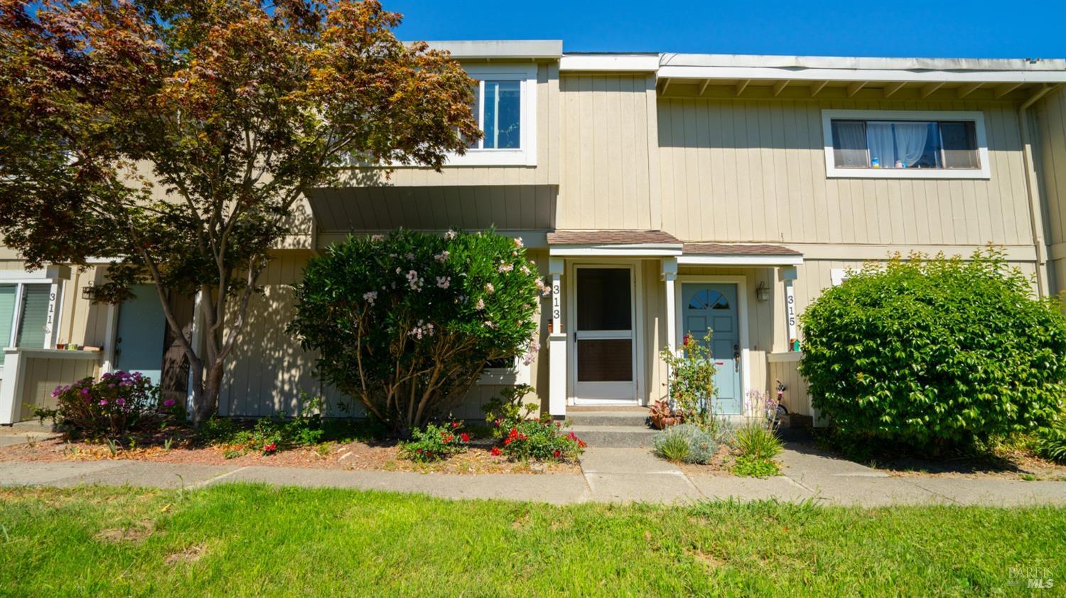 a view of house with yard