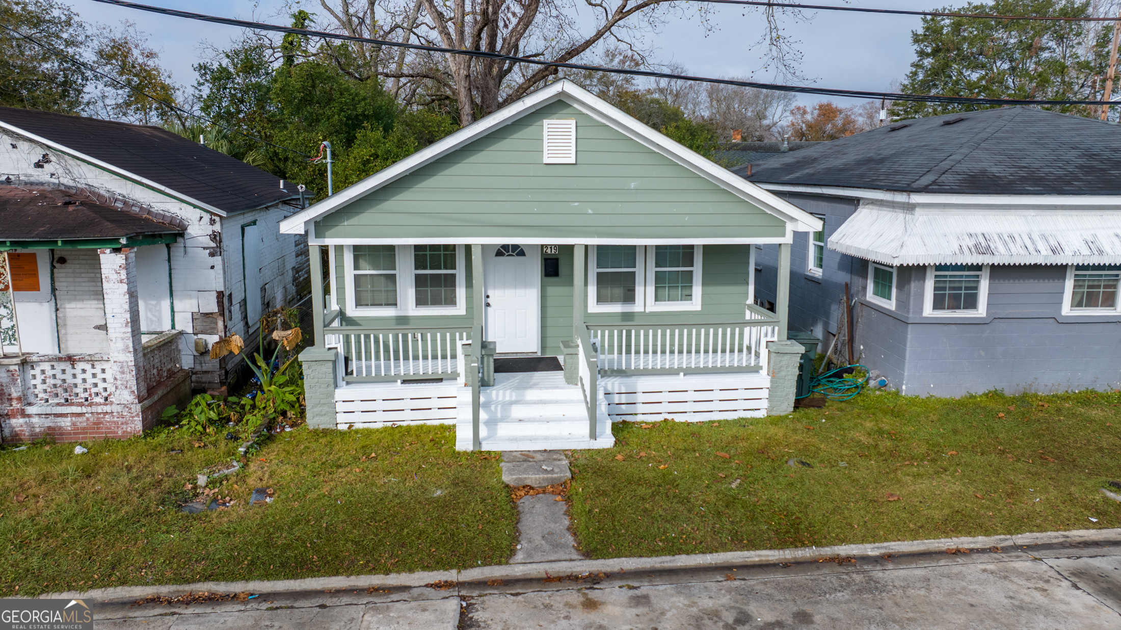 a front view of a house with garden