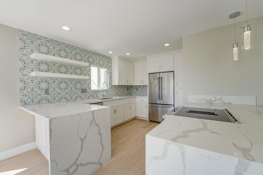 a kitchen with a sink stainless steel appliances and cabinets