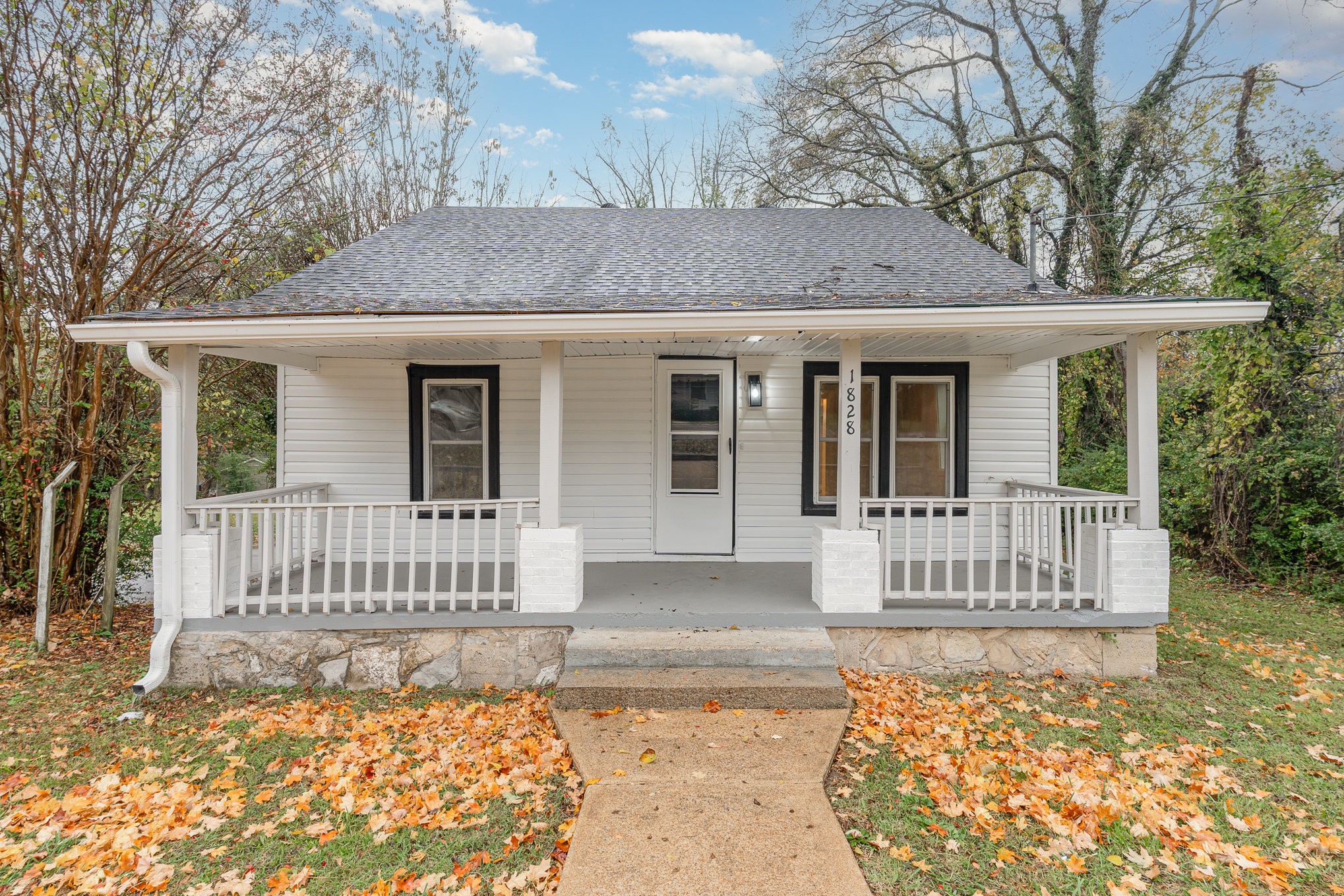 a front view of a house with a porch