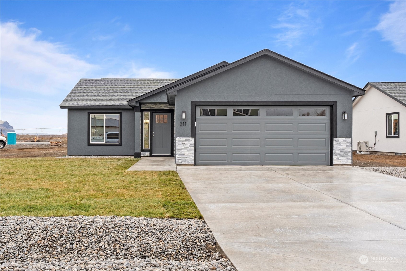 a front view of a house with a yard