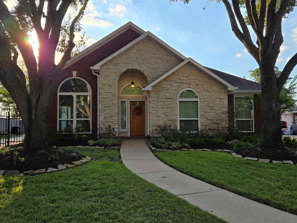 front view of a house with a yard