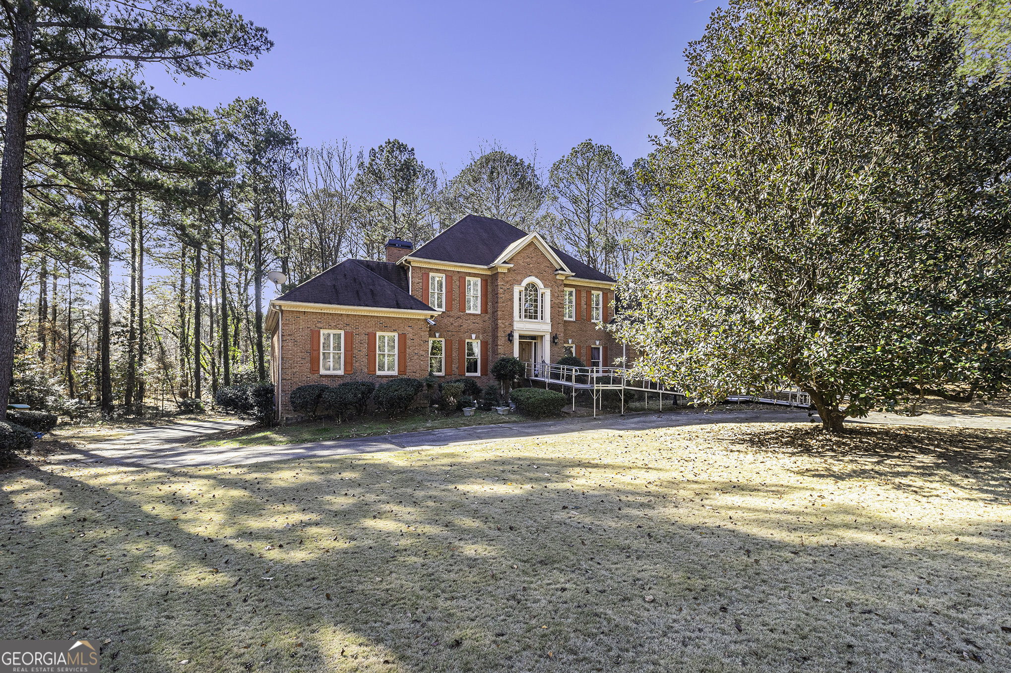 a front view of a house with a yard