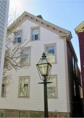 a front view of a house with yard