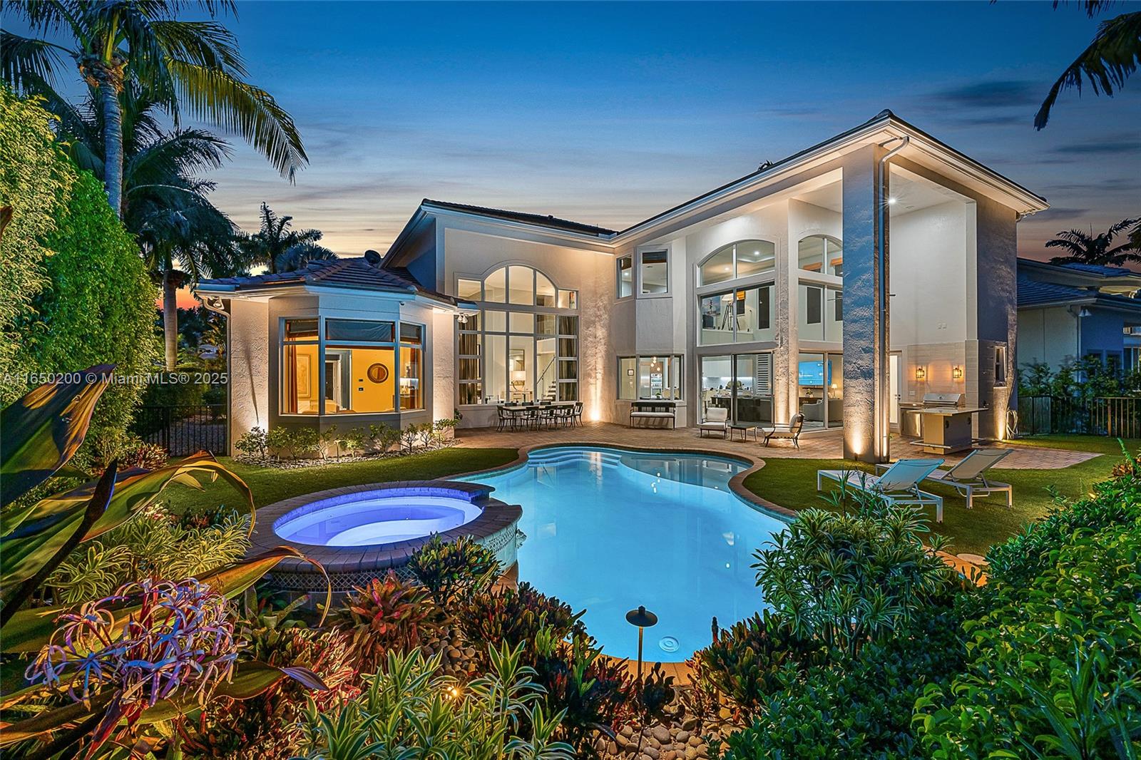 a front view of house and yard with swimming pool and furniture