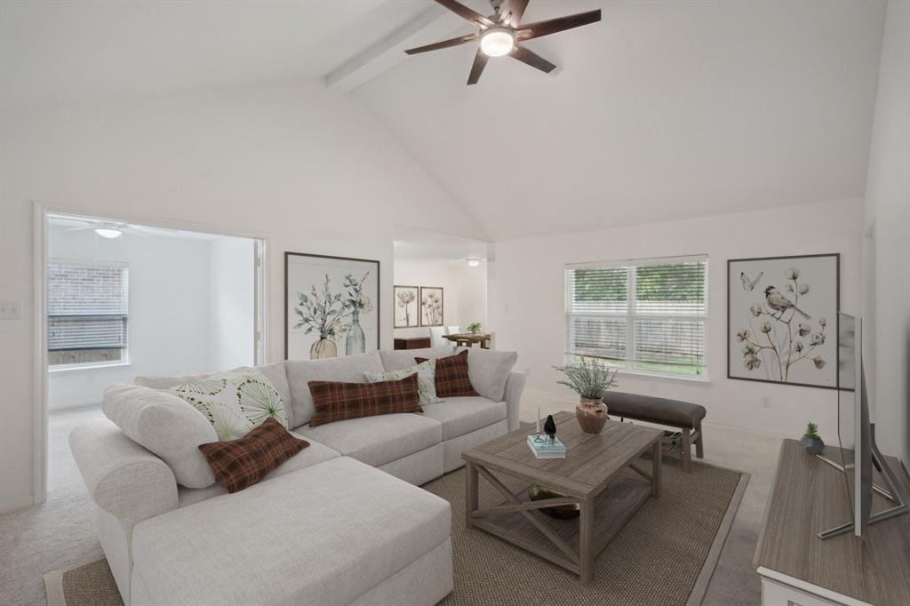 a living room with furniture and a window