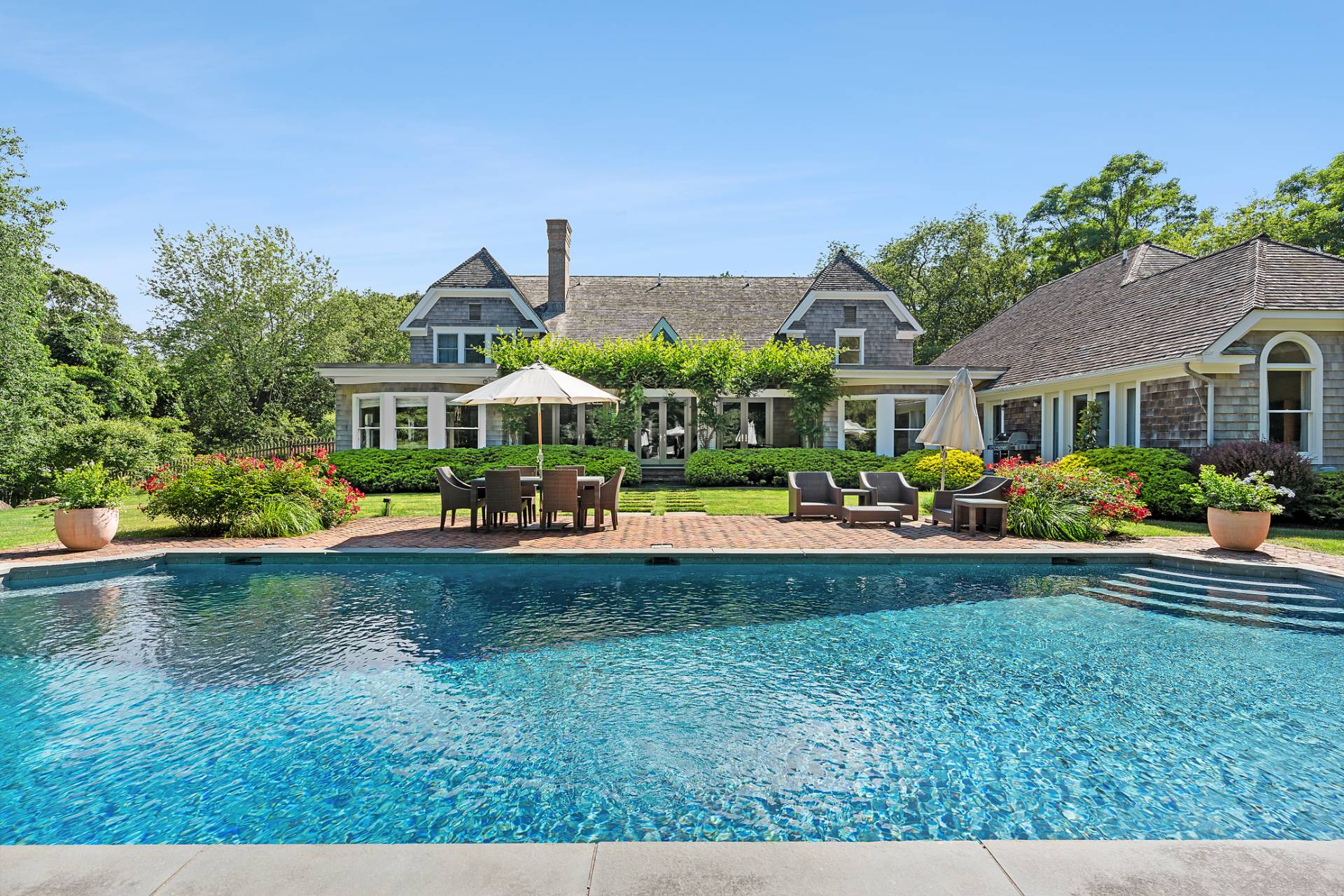 a view of a house with swimming pool yard and patio