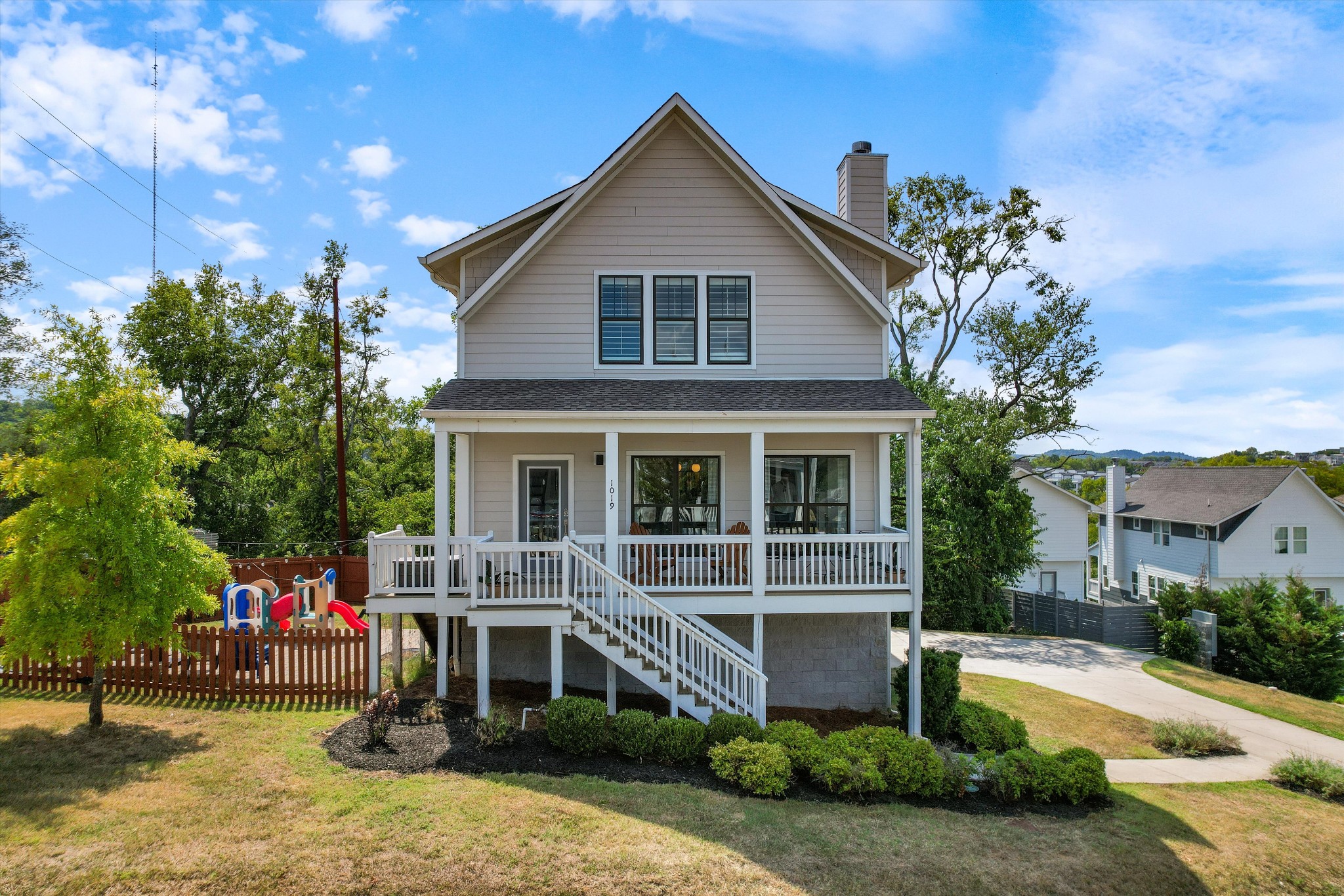 a front view of a house with garden