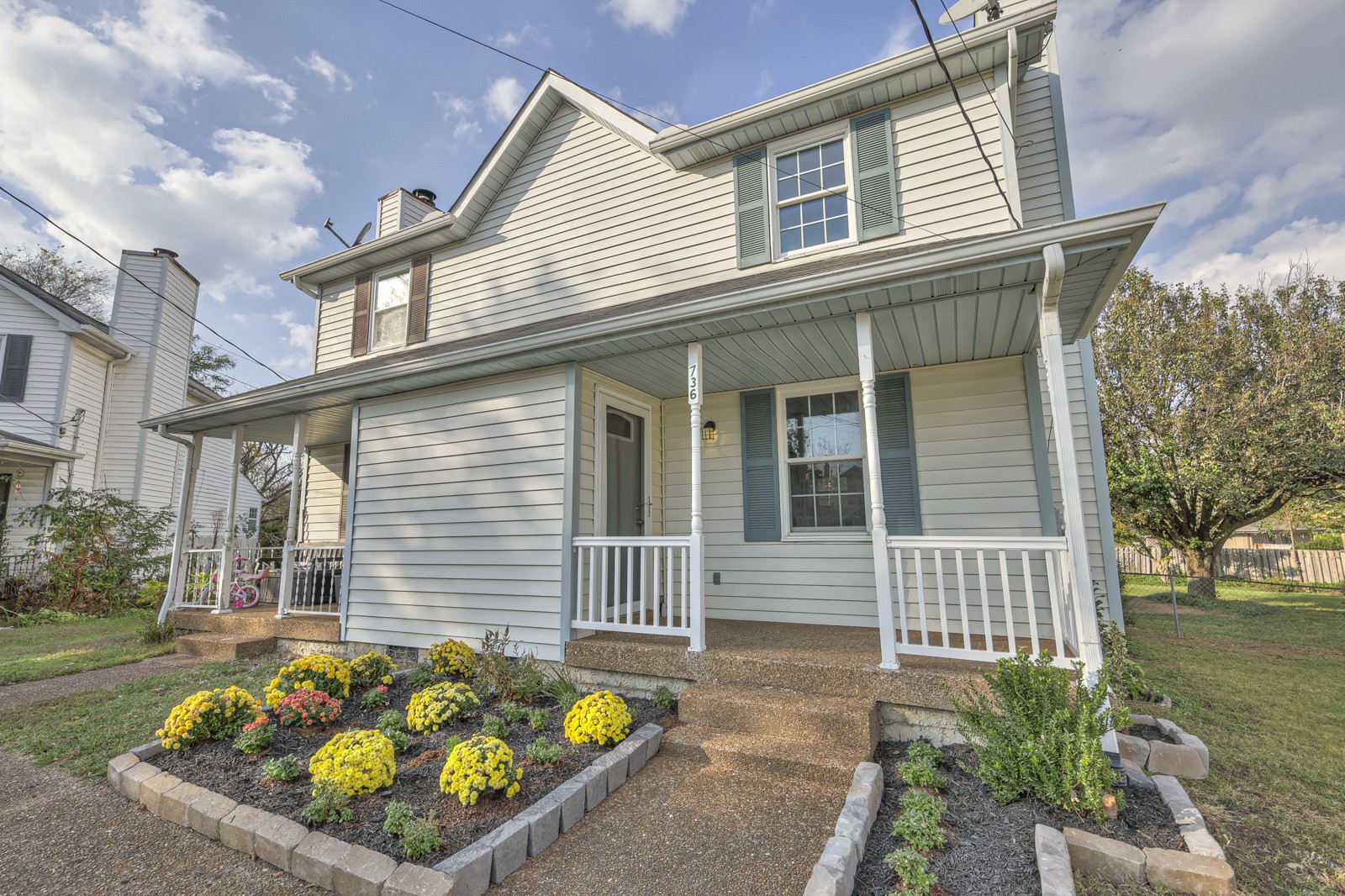 front view of a house with a small yard