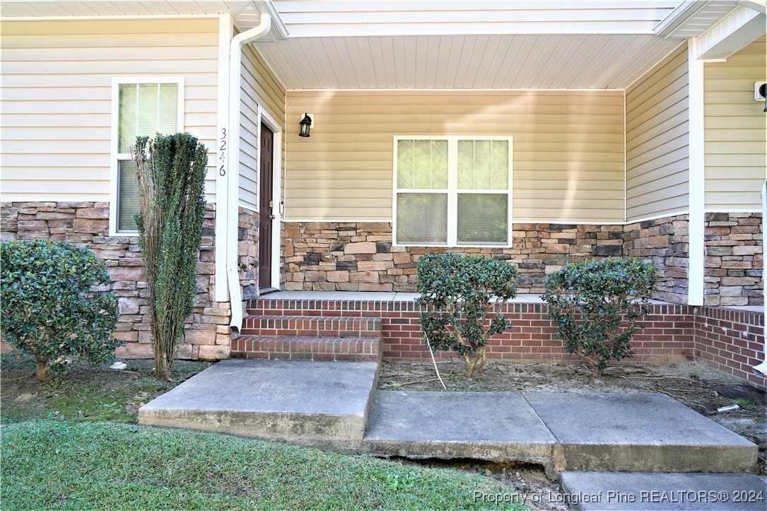 a front view of a house with a porch