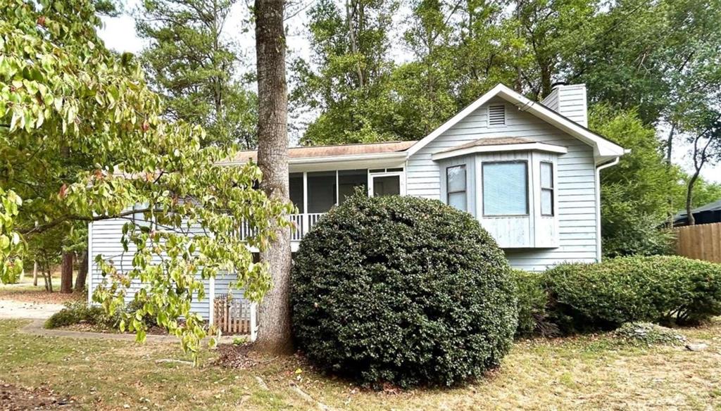 front view of a house with a yard