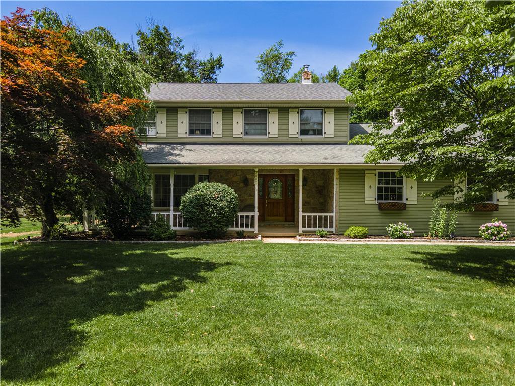 front view of a house with a garden