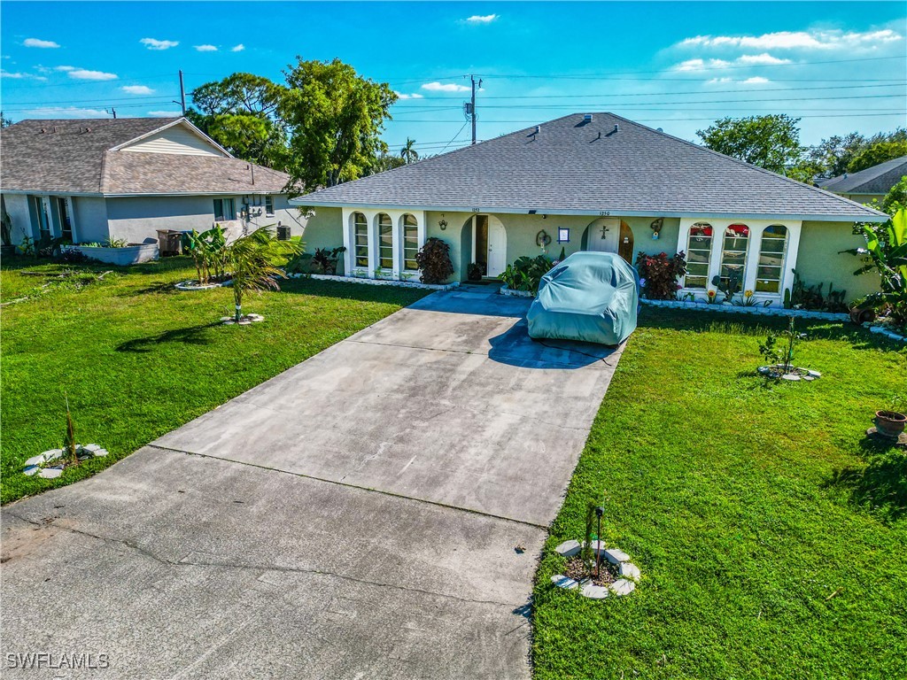 a front view of a house with garden