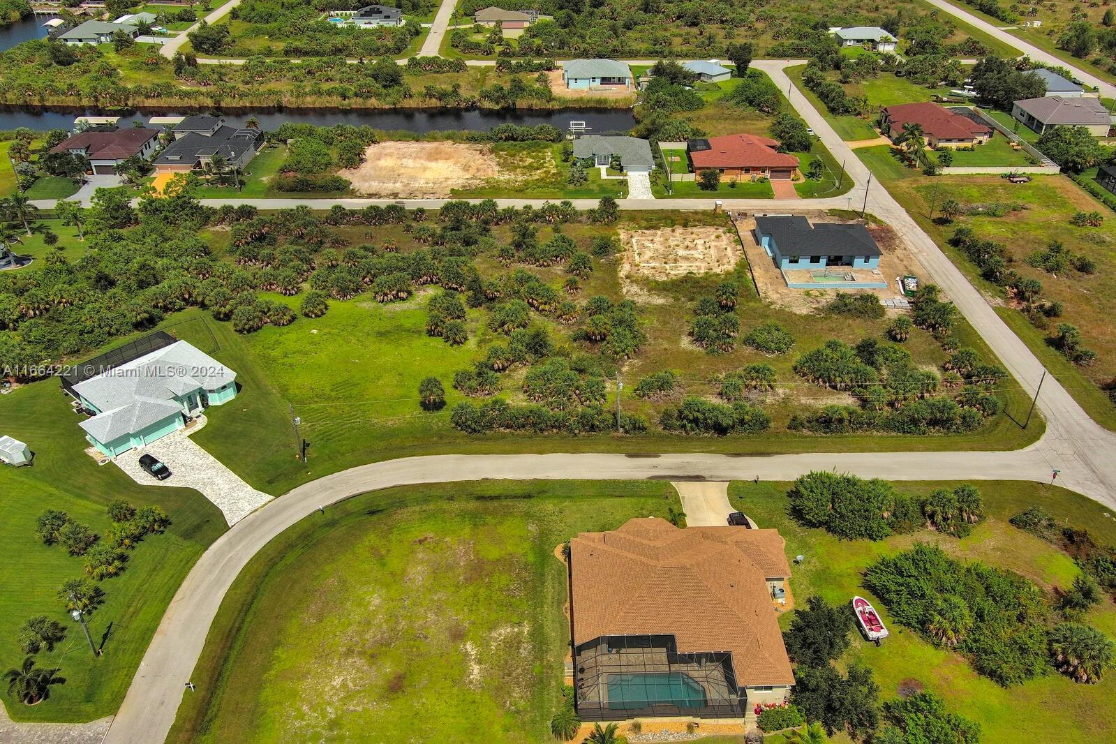 an aerial view of a residential houses with outdoor space