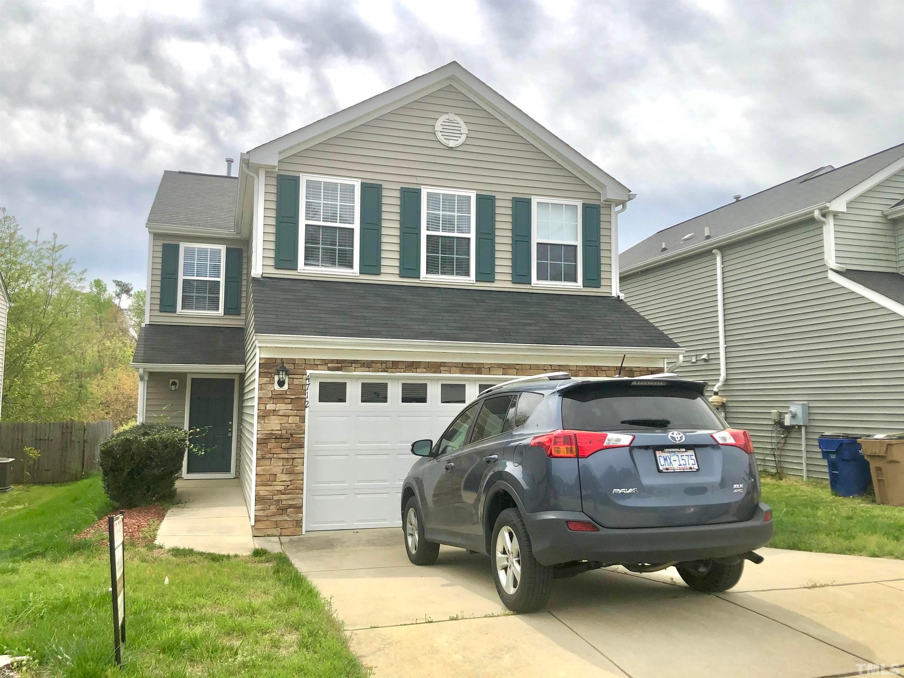 a car parked in front of a house