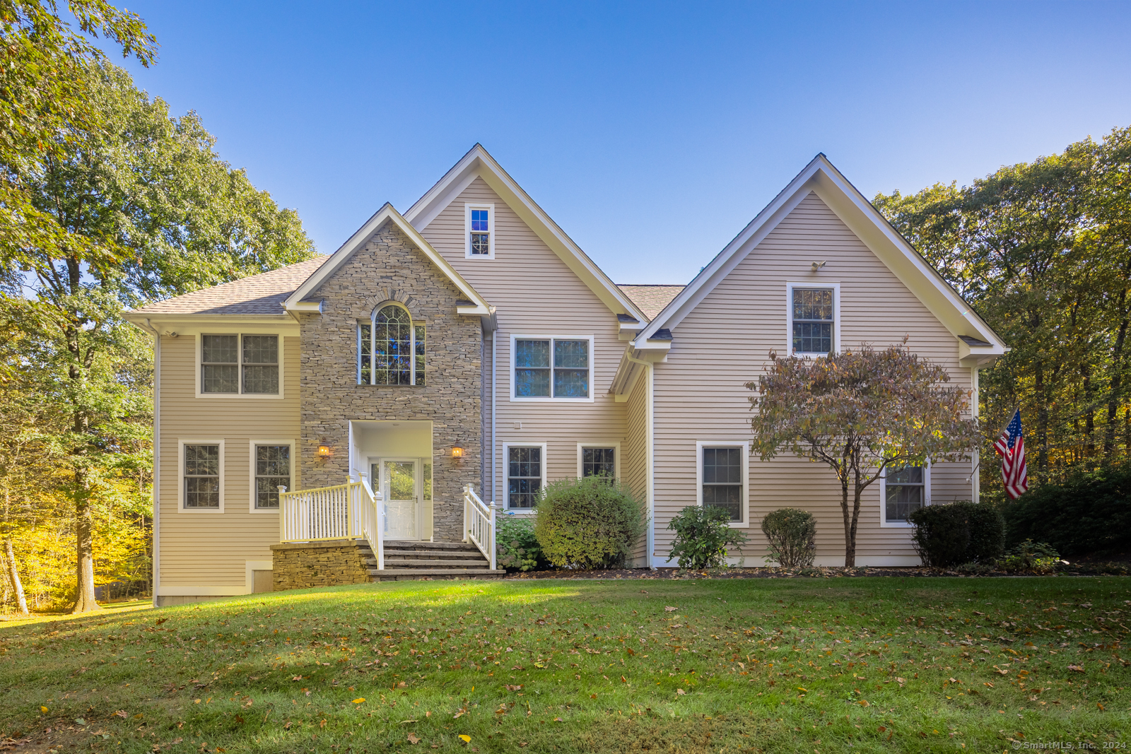 a front view of a house with a yard