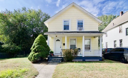 a view of a house with a yard and plants