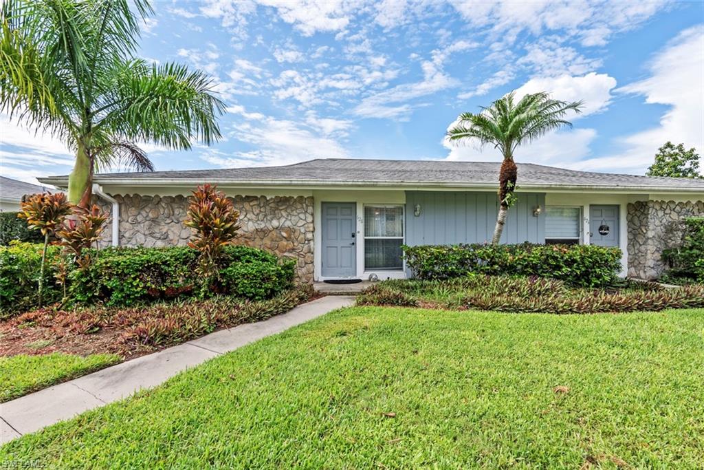 Ranch-style home with a front yard