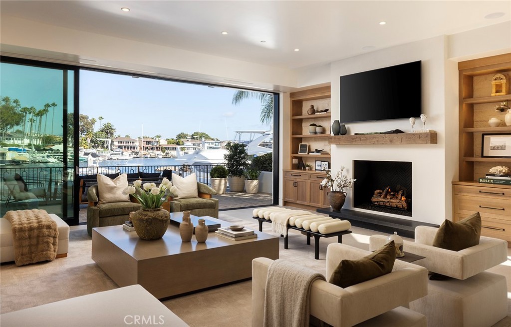 a living room with fireplace furniture and a flat screen tv