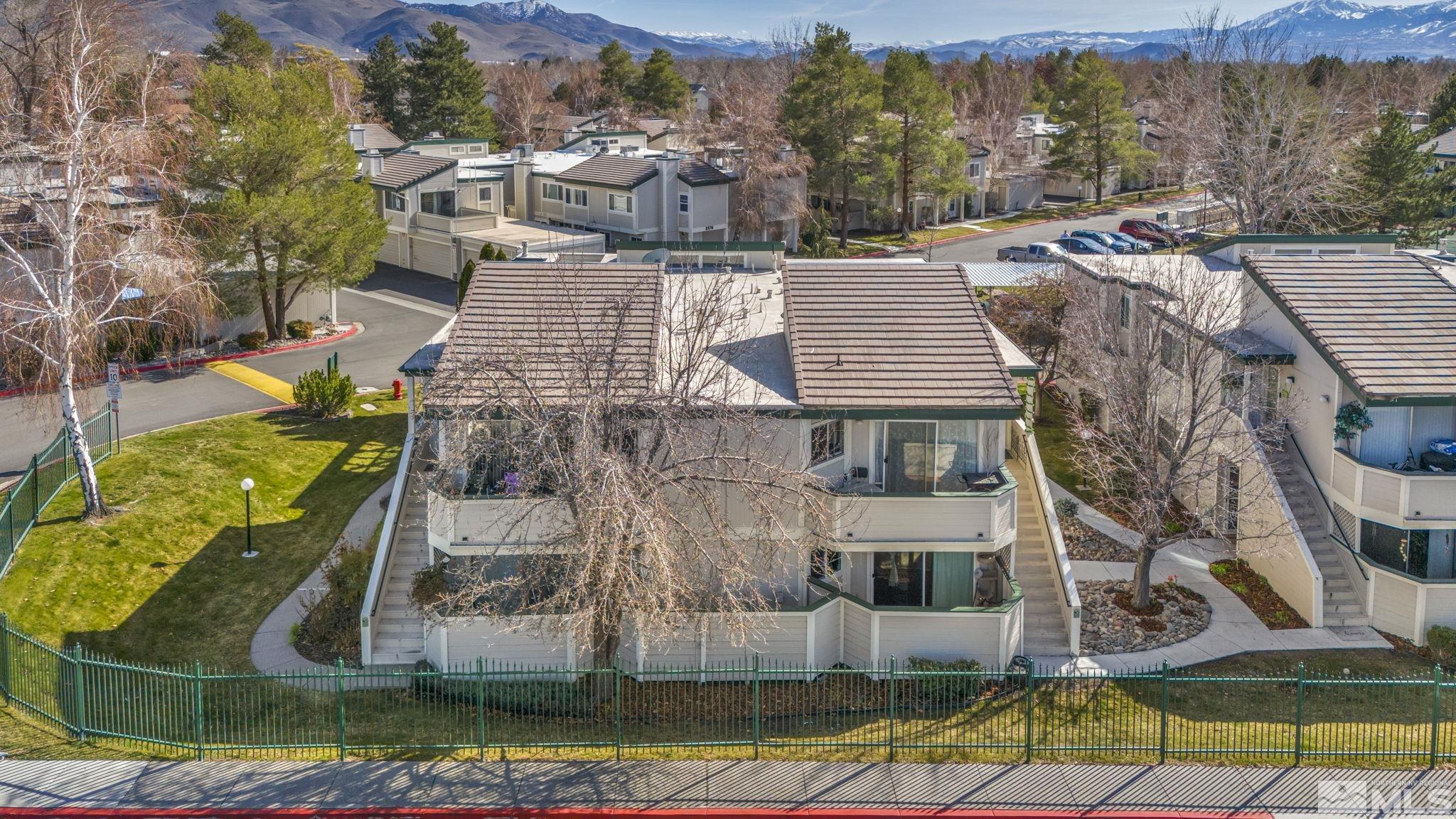 a aerial view of a house with a yard