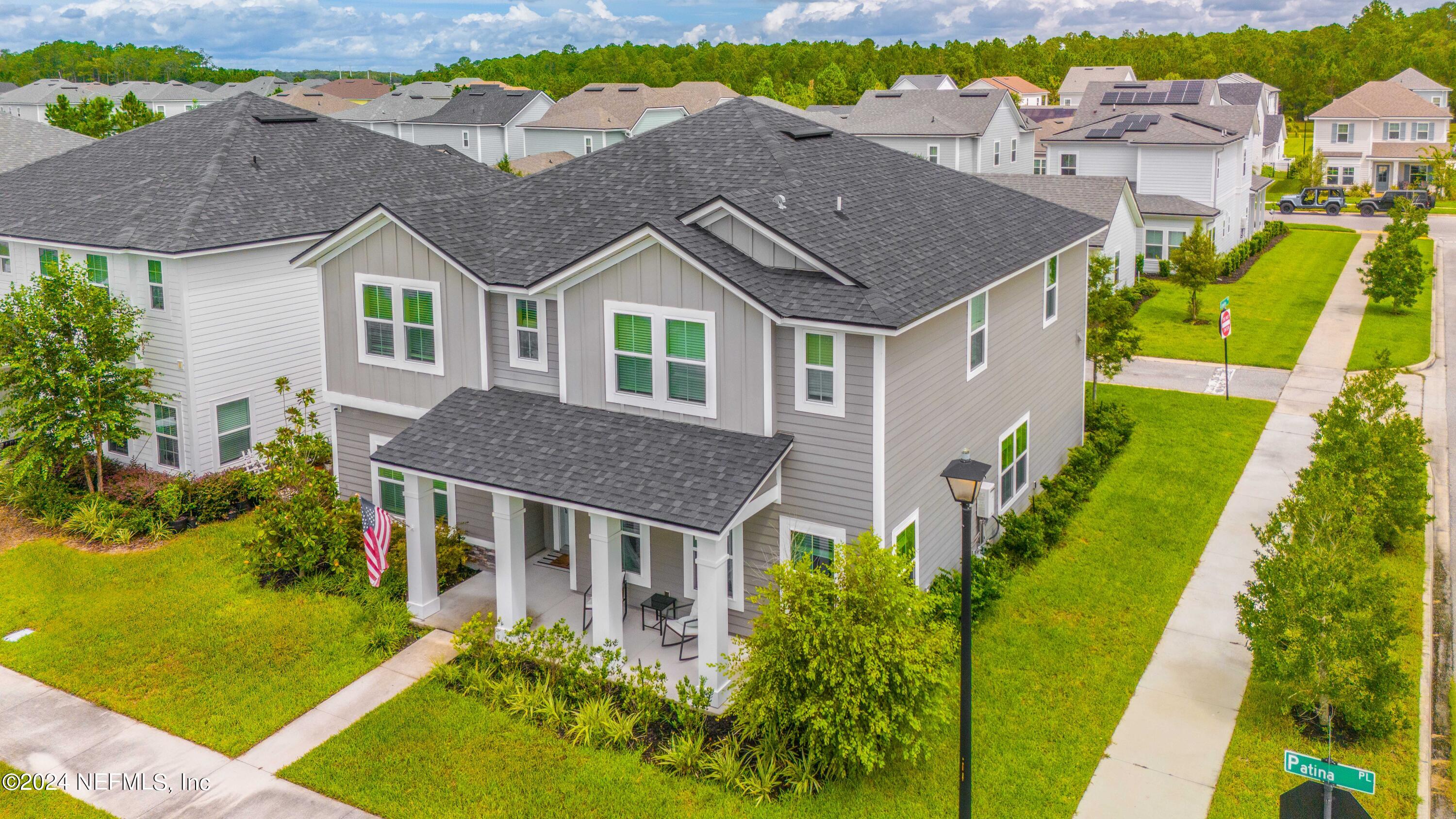 an aerial view of multiple houses on a yard