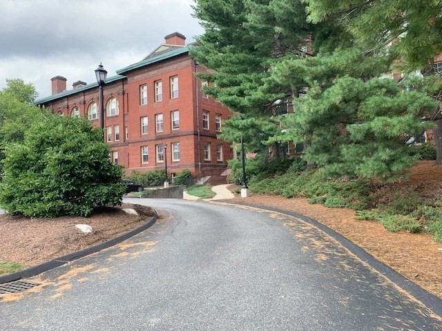 a view of a street in front of a house