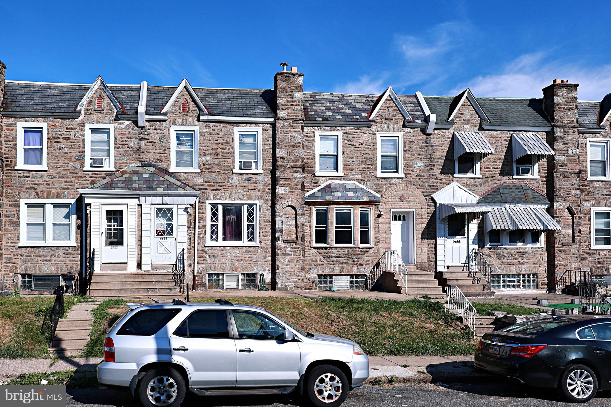 a car parked in front of a house