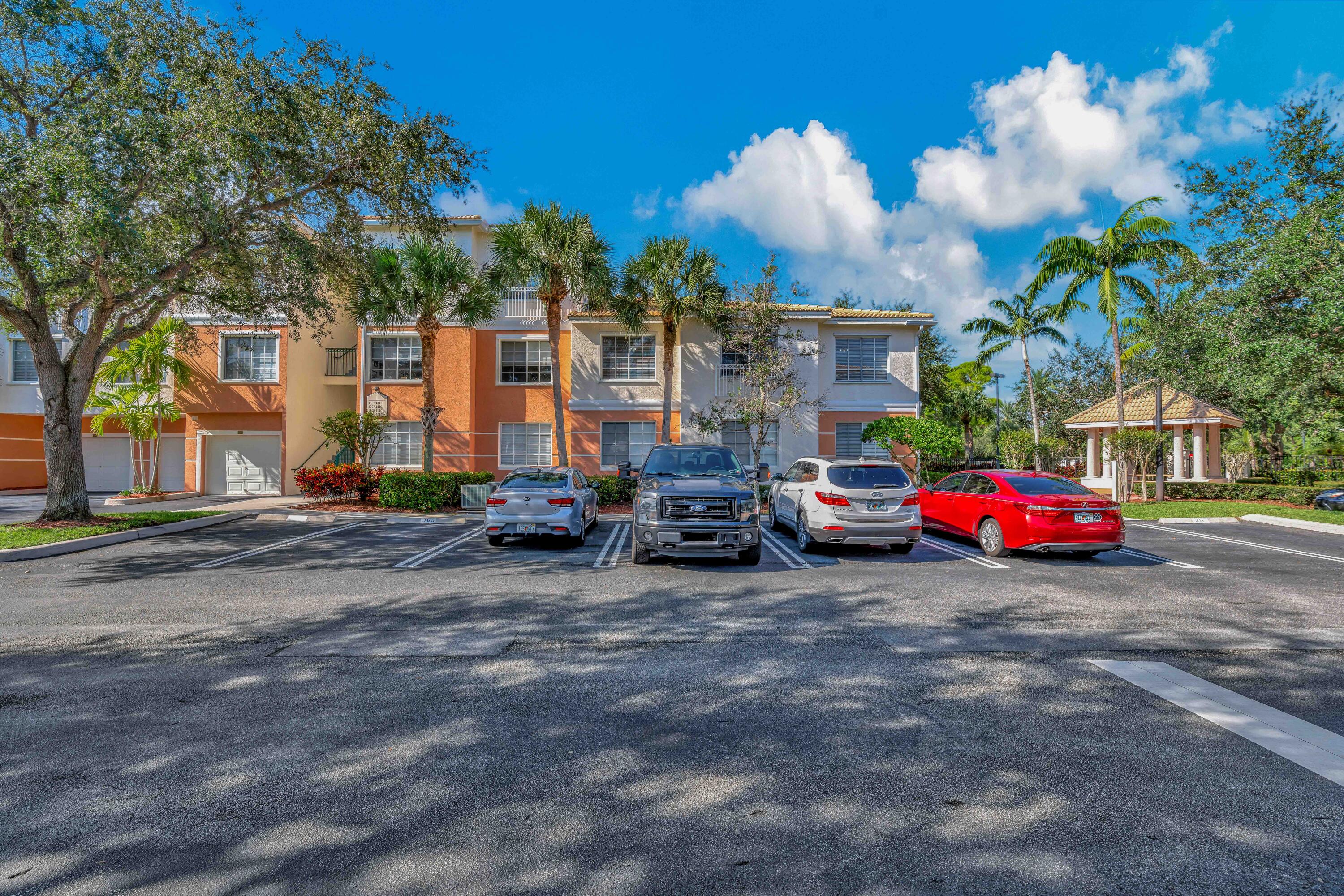 a view of cars parked in front of a house