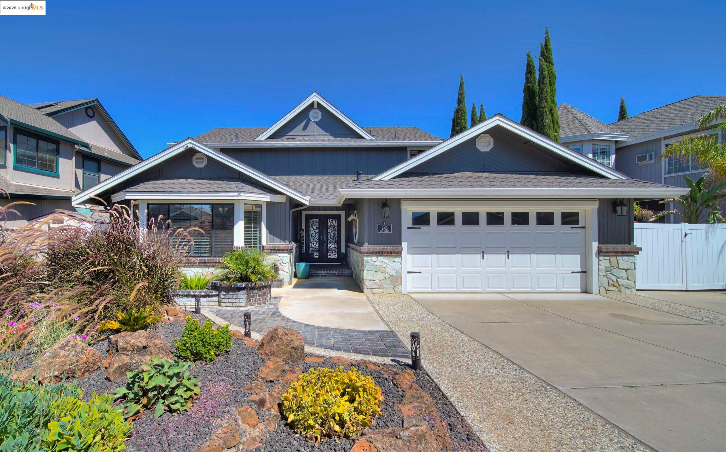 a front view of a house with garden