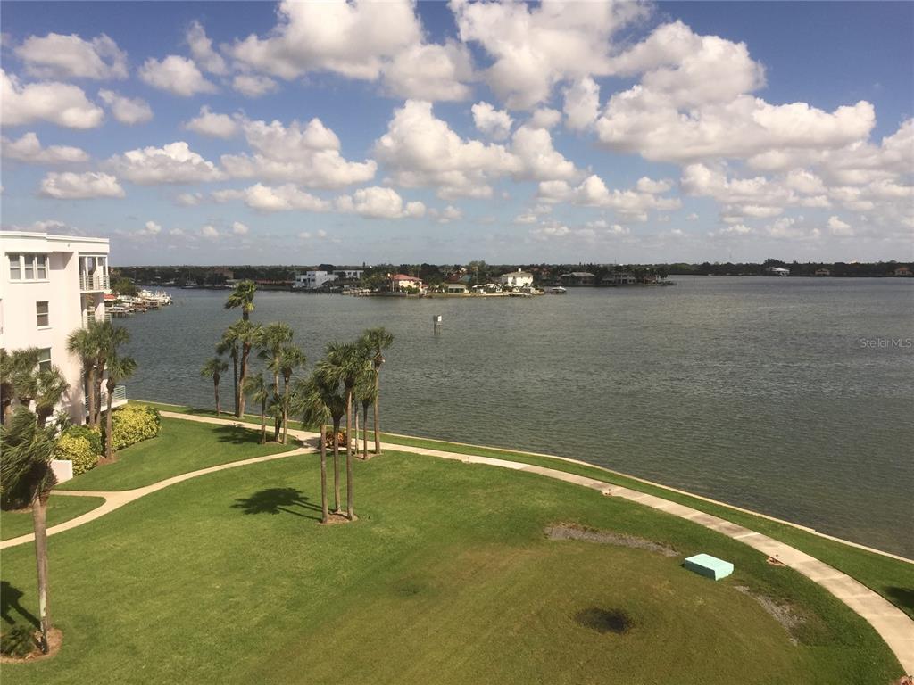 a view of a lake with a yard