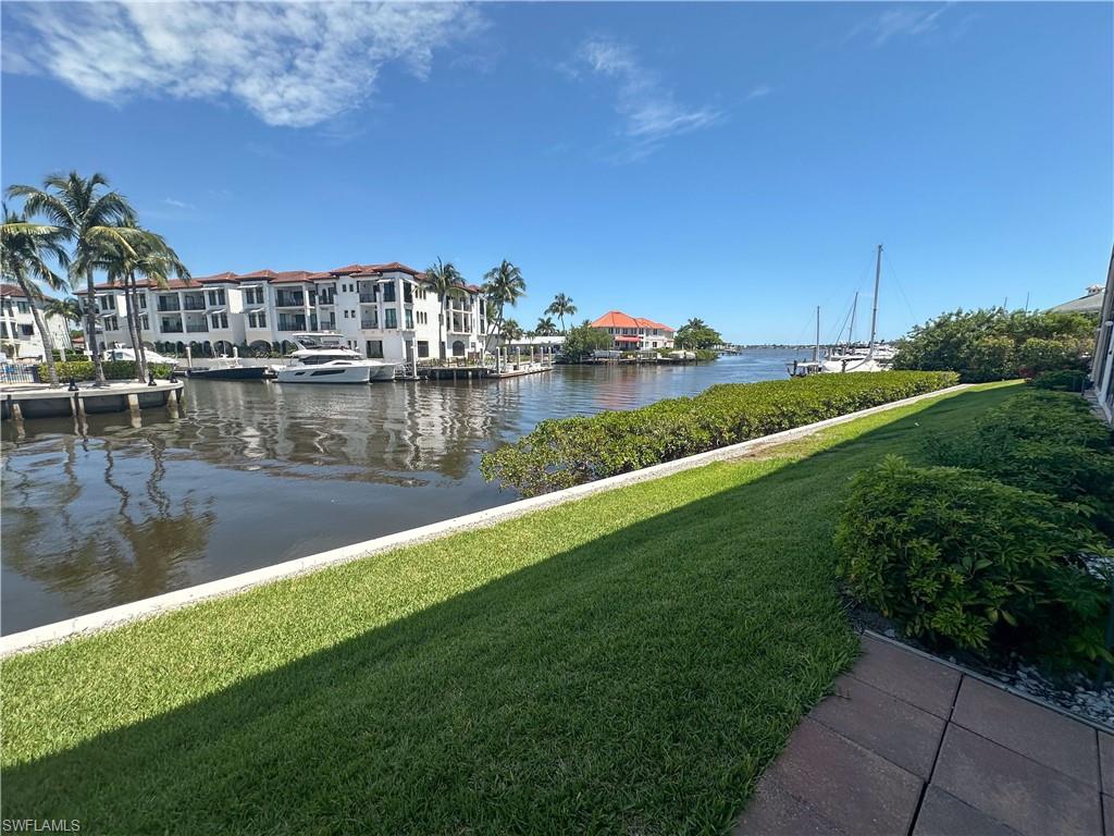 a view of a lake with a yard