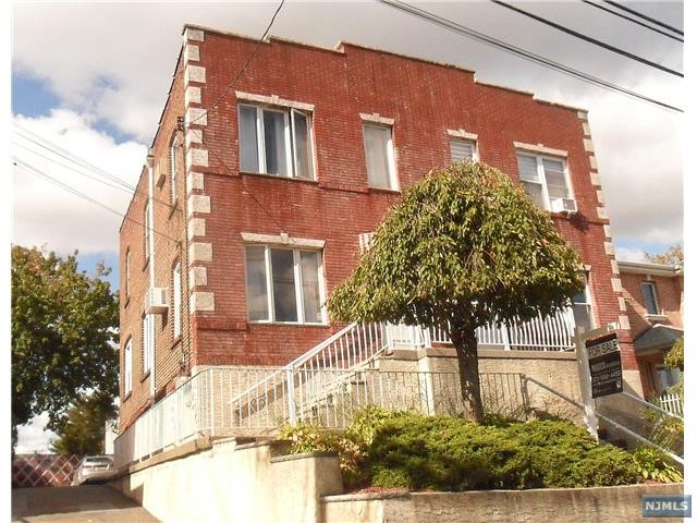 a front view of a multi story residential apartment building