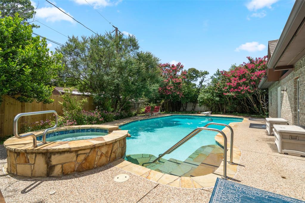 a view of a swimming pool with a lounge chair