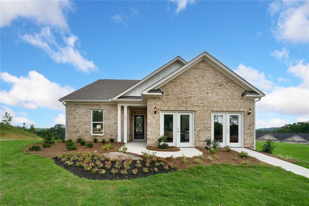 front view of a house with a yard