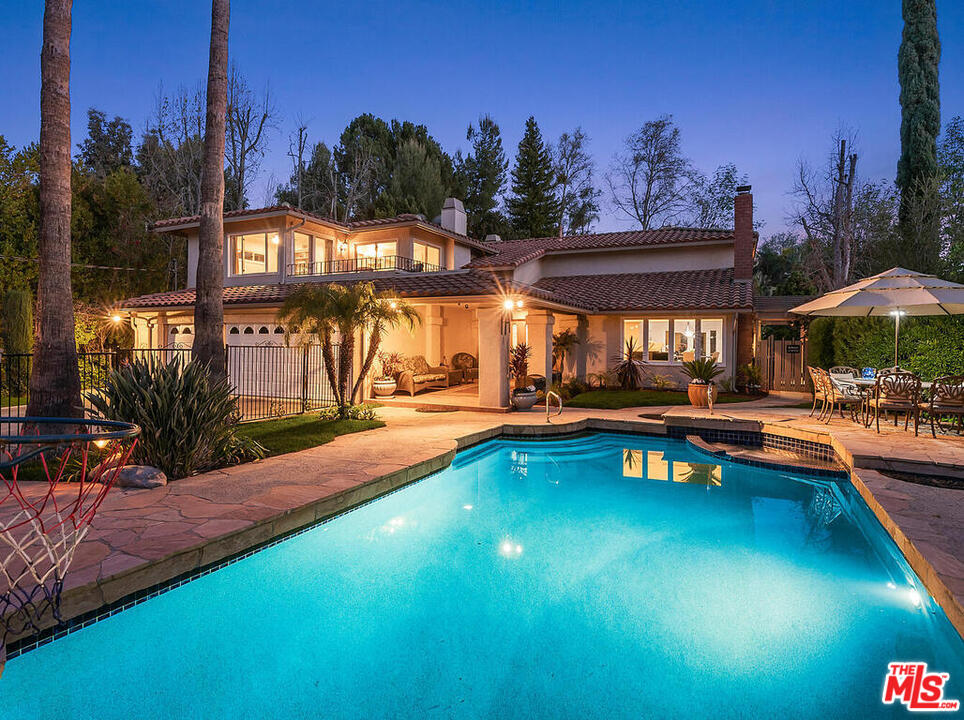 a view of swimming pool with outdoor seating