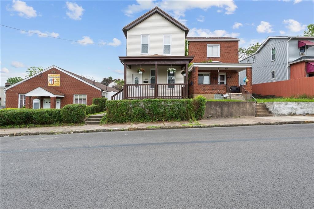 front view of a house with a street