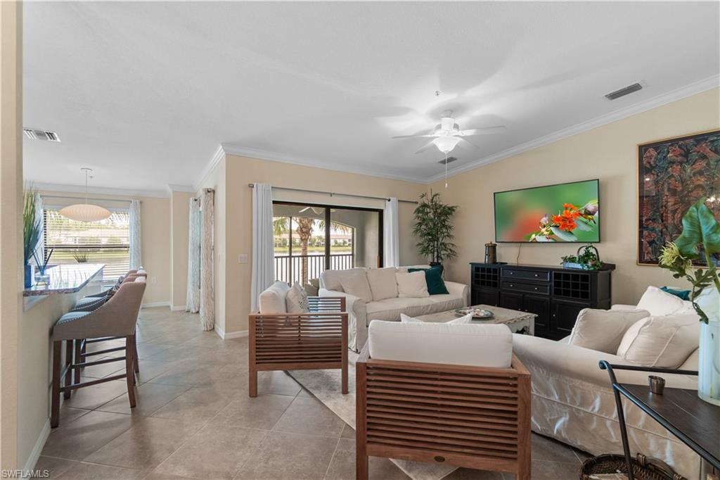 a living room with fireplace furniture and a flat screen tv