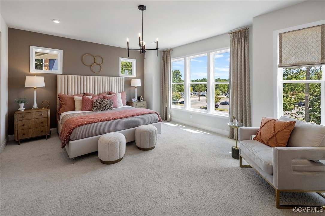 a spacious bedroom with a bed and glass window