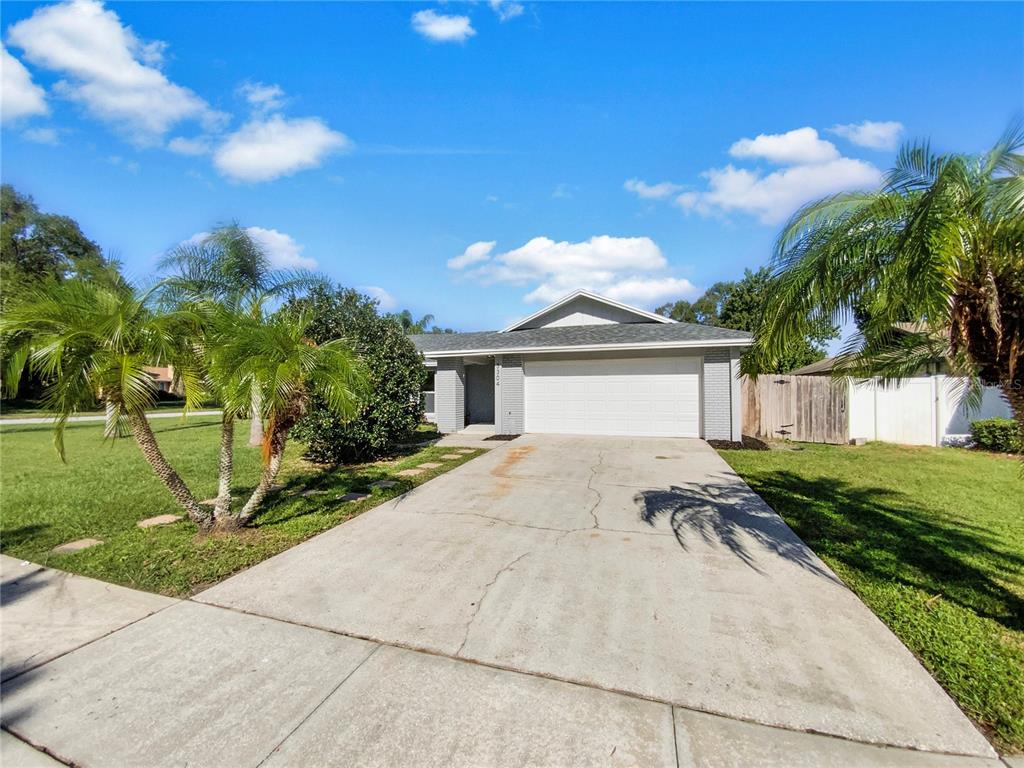 a view of a house with a yard