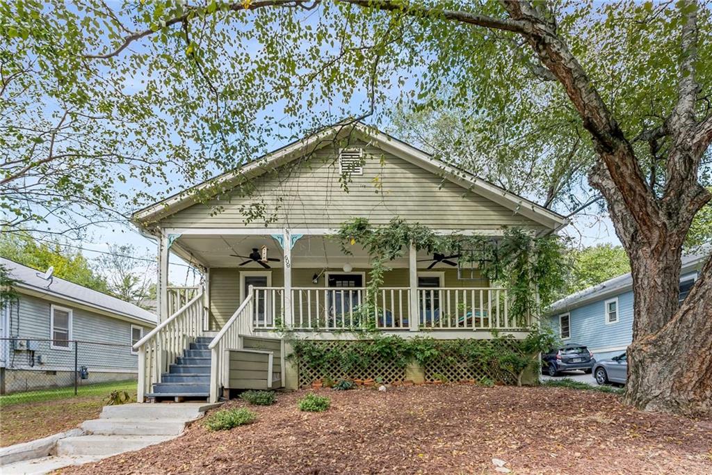 a view of a house with a yard and plants