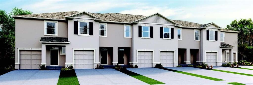 a front view of a house with a lots of windows and brick walls