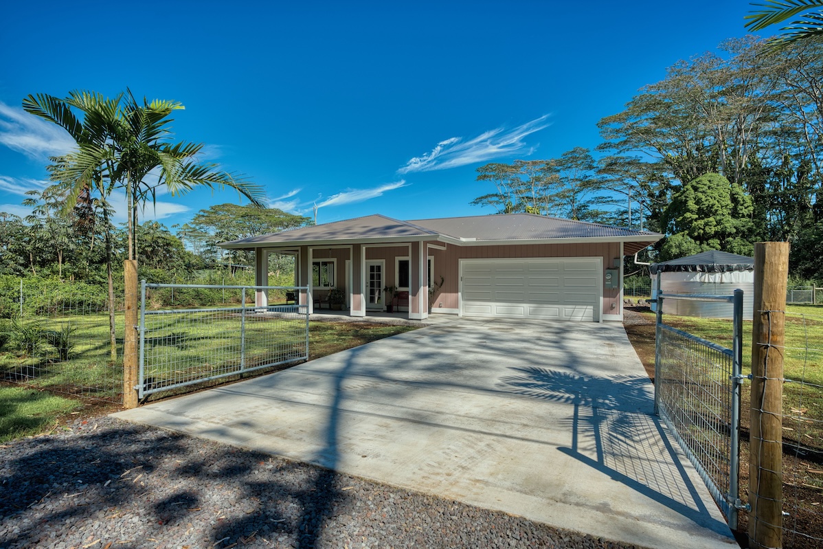 a view of house with outdoor space and garden