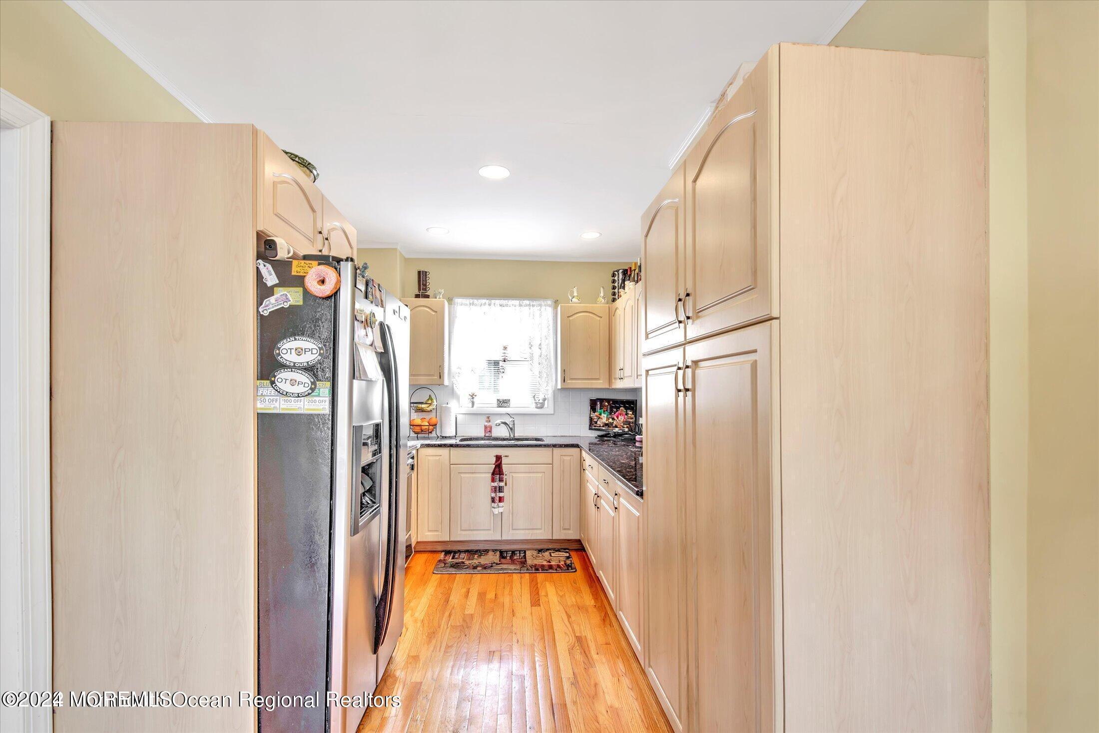 a kitchen with stainless steel appliances a refrigerator and a stove