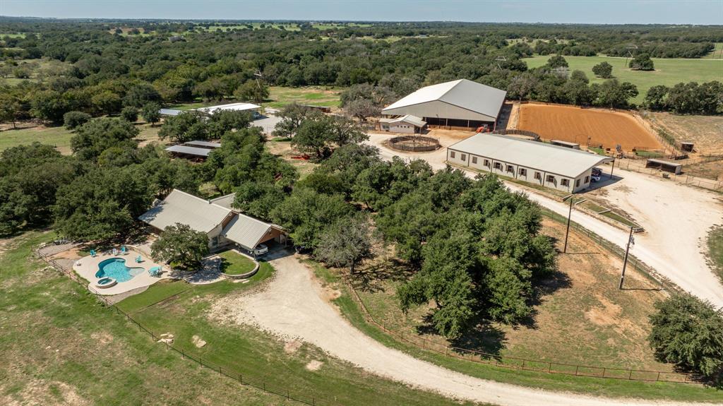 an aerial view of a house with yard