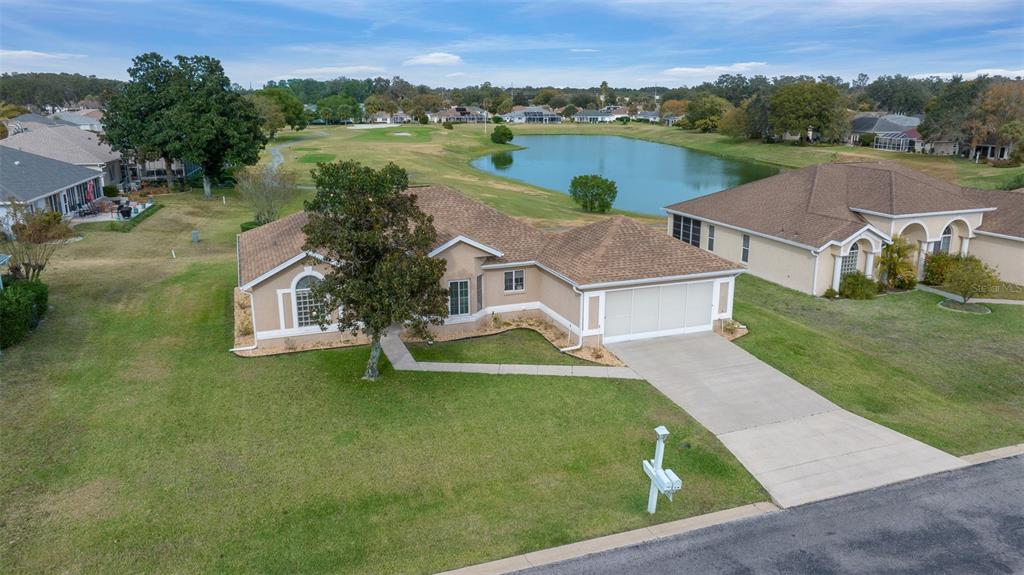 an aerial view of a house with outdoor space