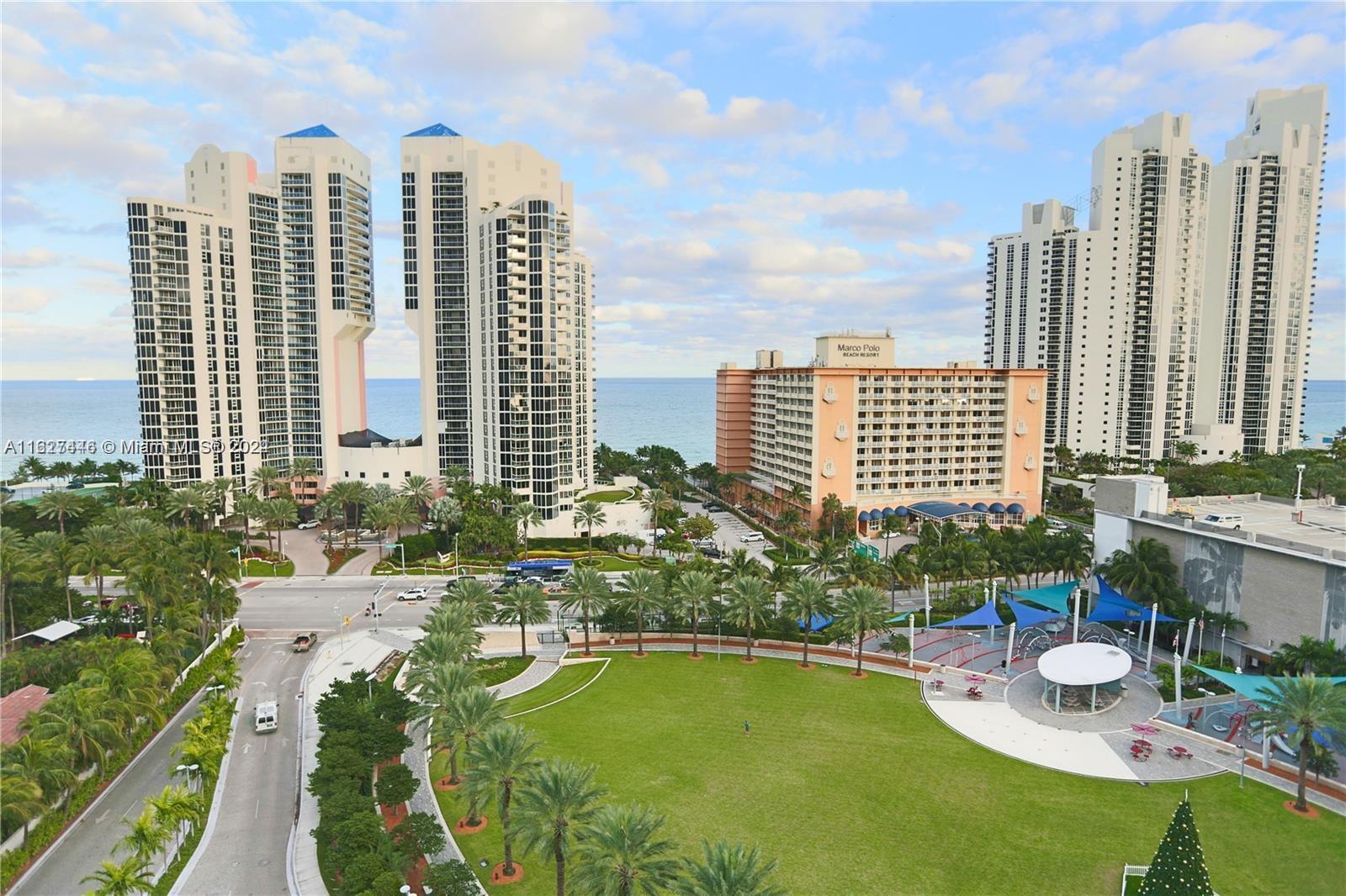 a view of a city with tall buildings