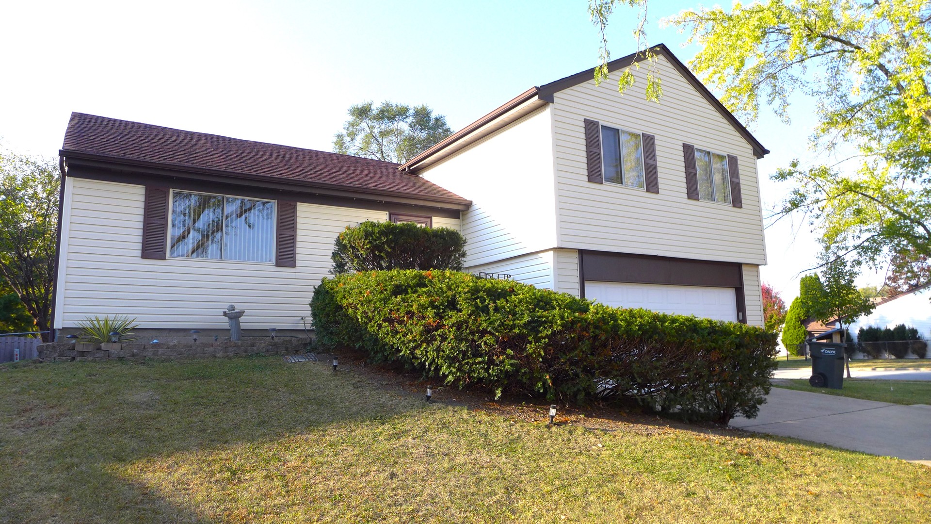 a front view of a house with garden