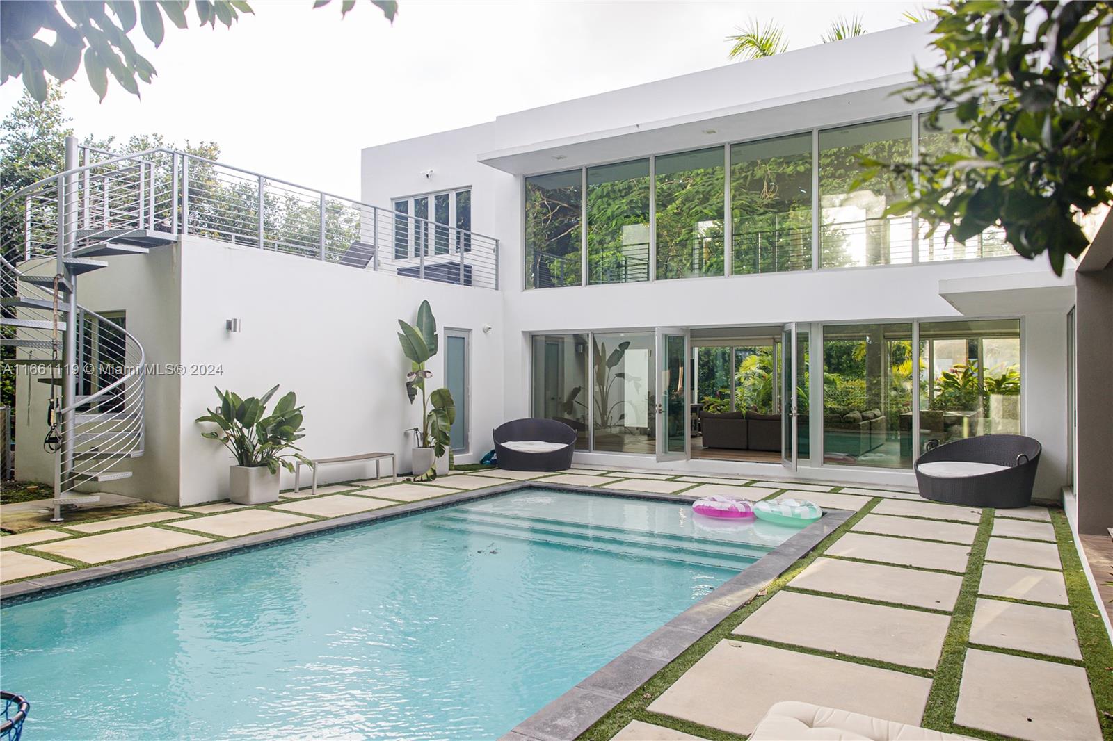 a view of swimming pool with an outdoor seating