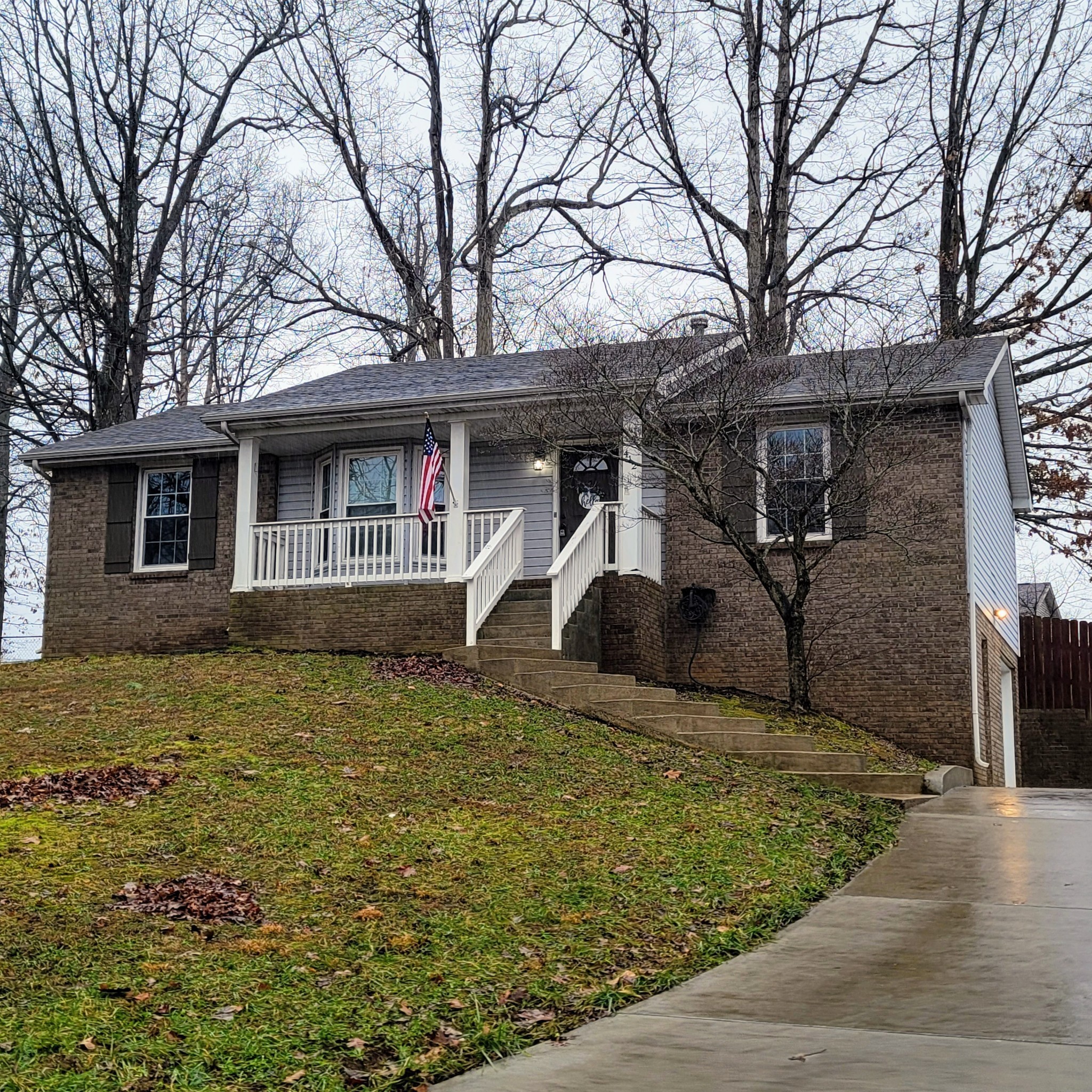 a front view of a house with garage